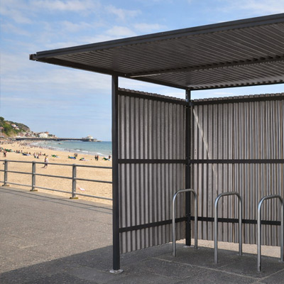 Black Traditional Cycle Shelter closed-back on a beach front